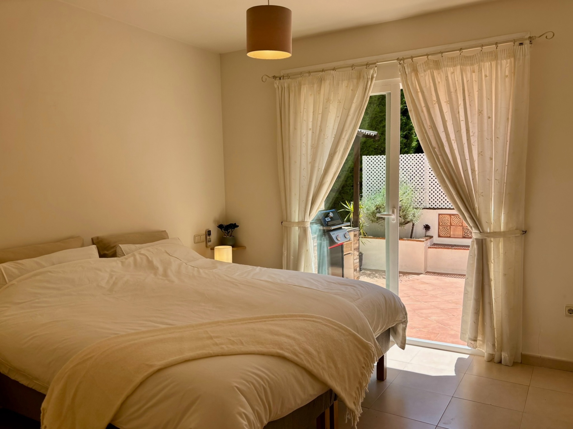 Garden bedroom · Quiet mornings with the door to the patio