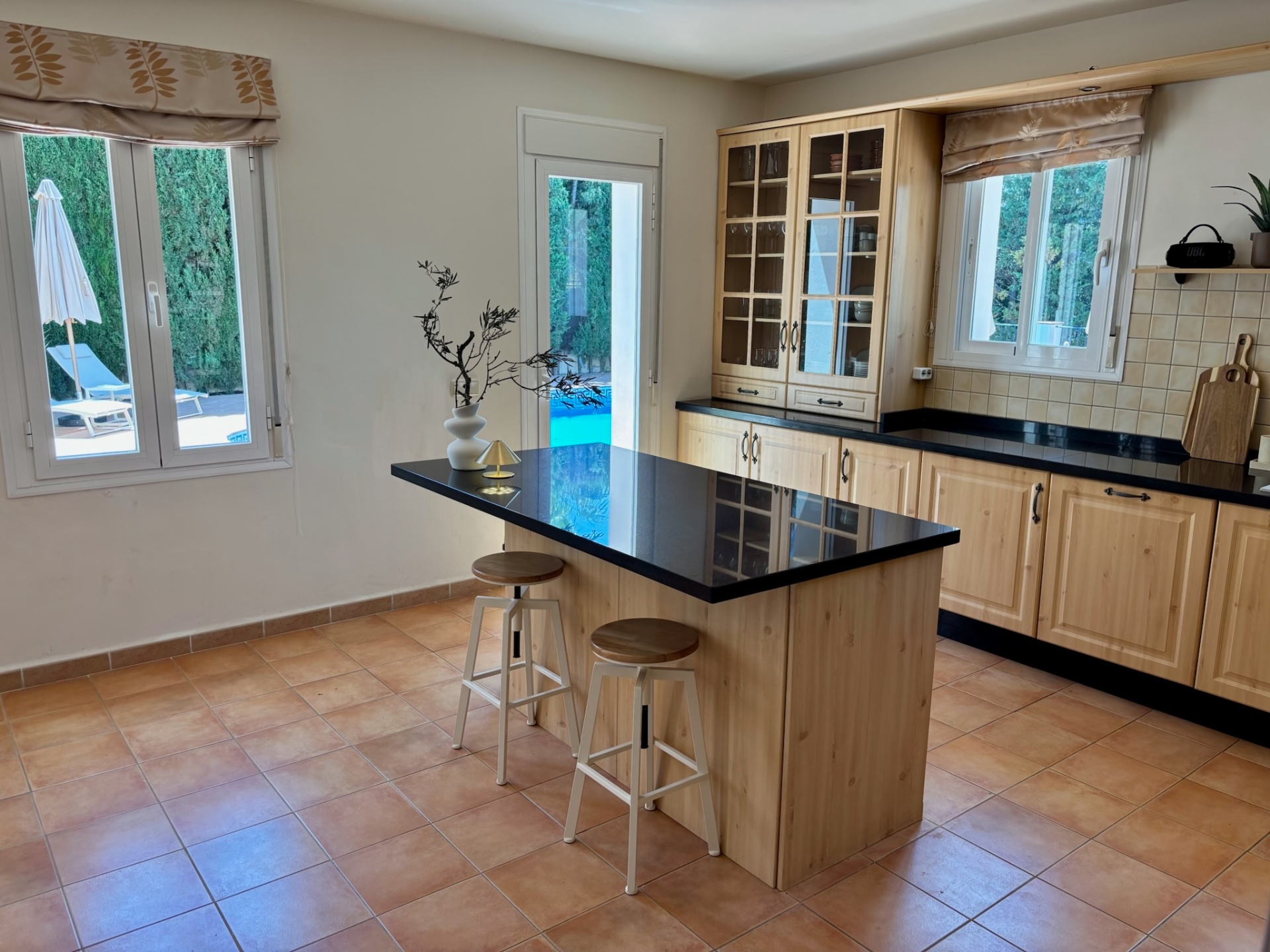 The kitchen · Wood, granite, and a proper espresso machine