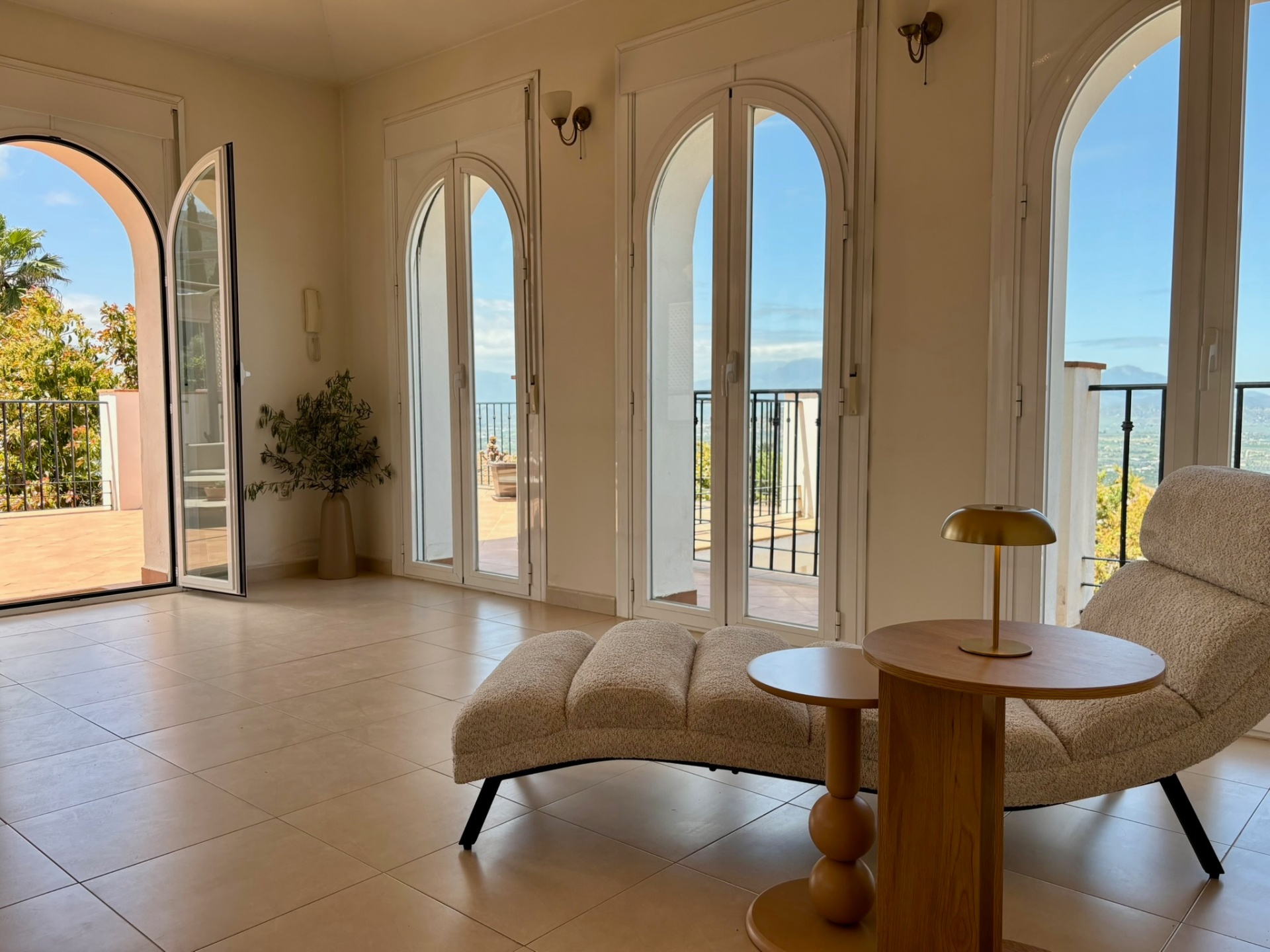The lounge · Arched doors out to the view